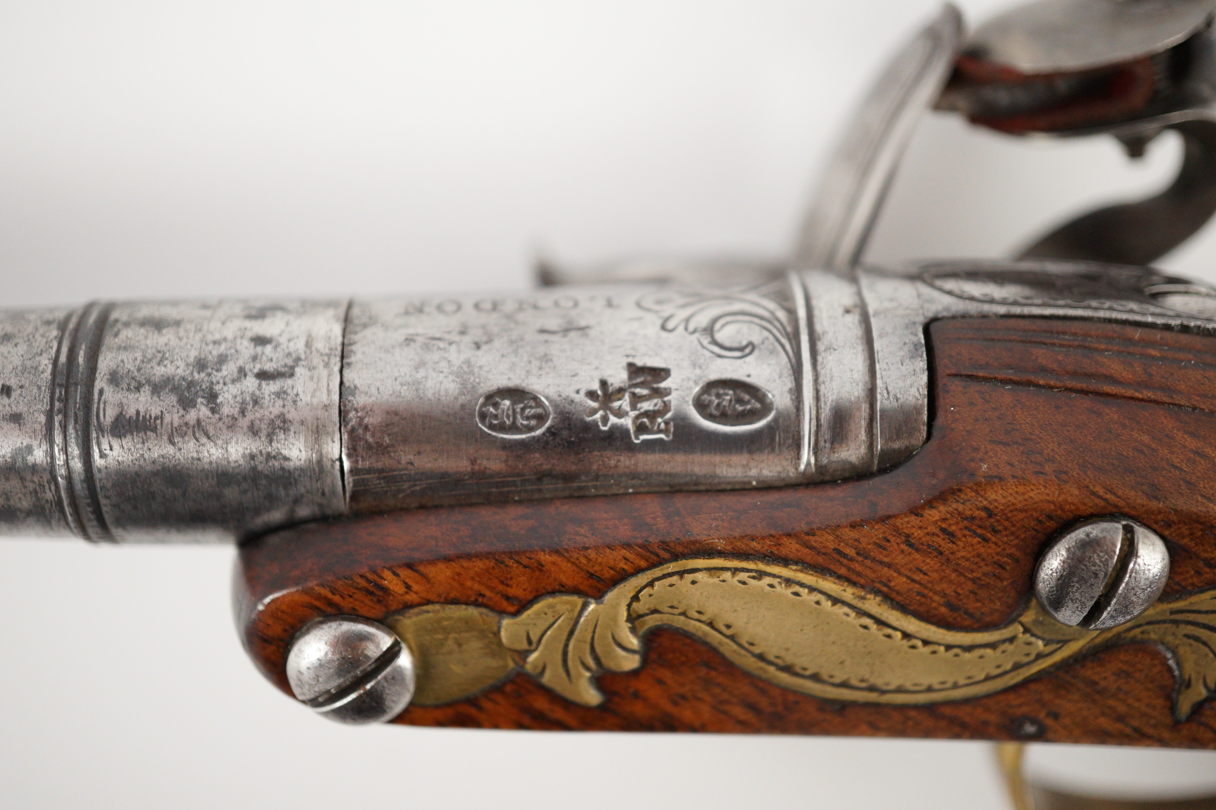 Wilson of London. An early 18th century flintlock pocket pistol, 11cm high 19cm long